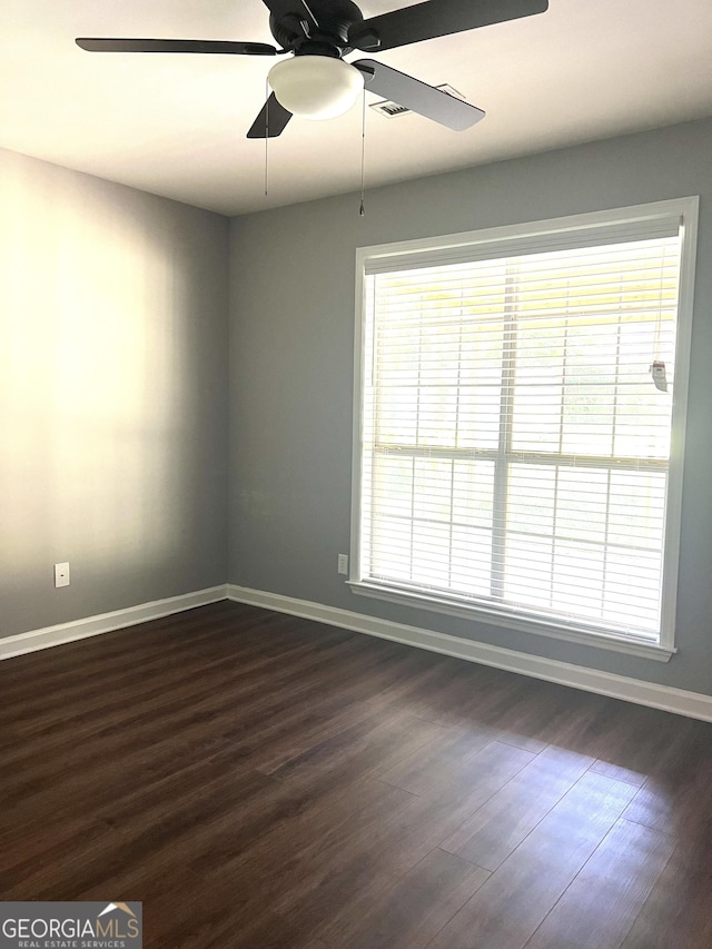 1905 Ridgefield Way, Dalton, GA 30720 - spare room with baseboards, dark wood finished floors, a ceiling fan, and healthy amount of natural light