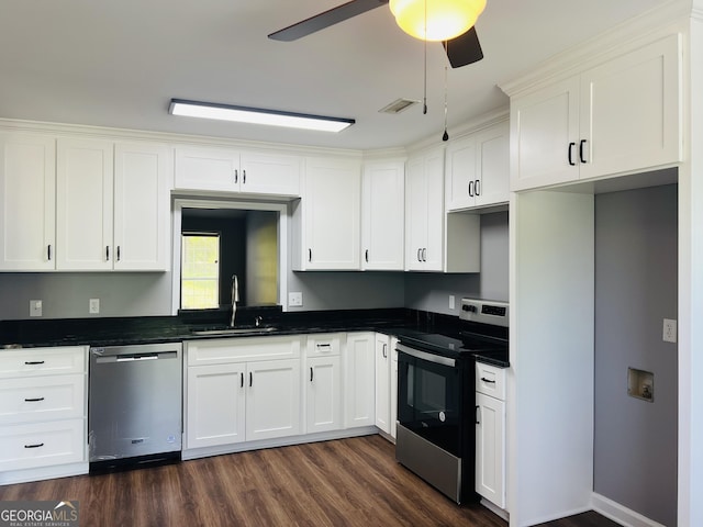 1905 Ridgefield Way, Dalton, GA 30720 - kitchen featuring stainless steel appliances, dark countertops, a sink, dark wood-type flooring, and white cabinetry