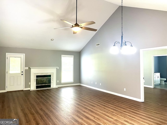 1905 Ridgefield Way, Dalton, GA 30720 - unfurnished living room featuring high vaulted ceiling, a ceiling fan, a chandelier, baseboards, and dark wood-style floors