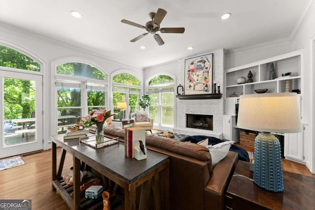 2936 Summitop Rd NE, Marietta, GA 30066 - living area featuring ceiling fan, crown molding, a brick fireplace, wood finished floors, and recessed lighting