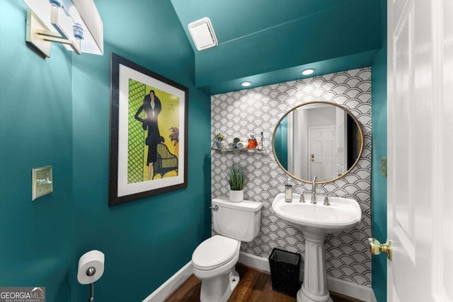 2936 Summitop Rd NE, Marietta, GA 30066 - half bath featuring toilet, wood finished floors, and baseboards