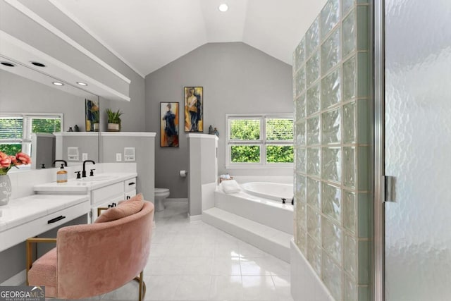 2936 Summitop Rd NE, Marietta, GA 30066 - full bathroom with a garden tub, lofted ceiling, healthy amount of natural light, vanity, and baseboards