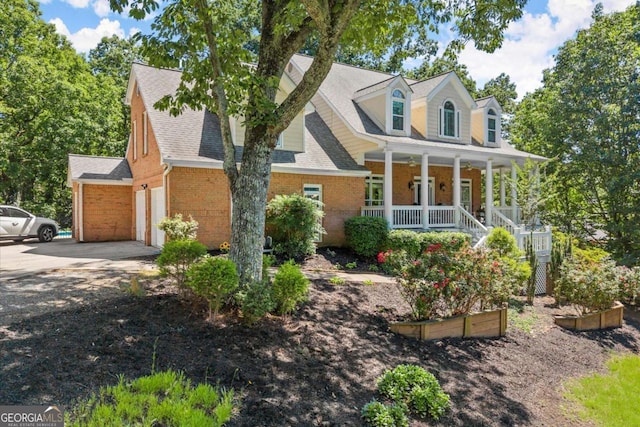 2936 Summitop Rd NE, Marietta, GA 30066 - cape cod house featuring a porch, brick siding, concrete driveway, and a shingled roof