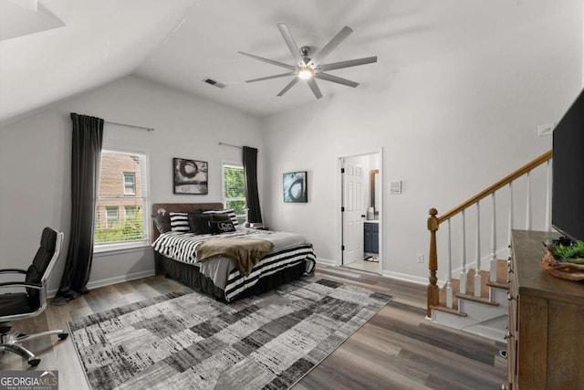 2936 Summitop Rd NE, Marietta, GA 30066 - bedroom with lofted ceiling, wood finished floors, baseboards, ceiling fan, and connected bathroom