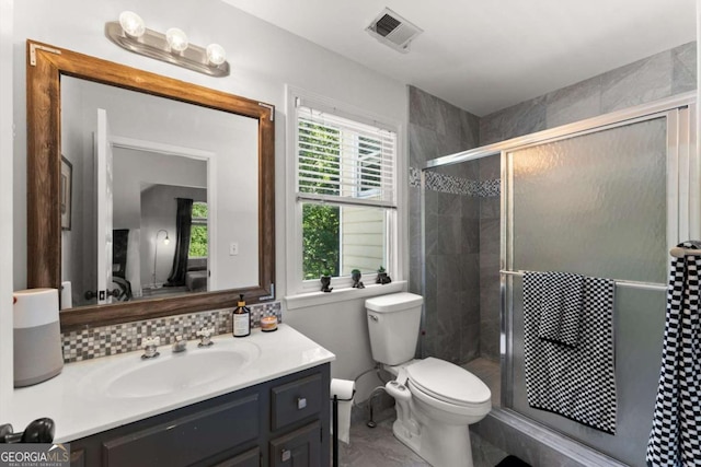 2936 Summitop Rd NE, Marietta, GA 30066 - bathroom with vanity, toilet, a shower stall, and decorative backsplash