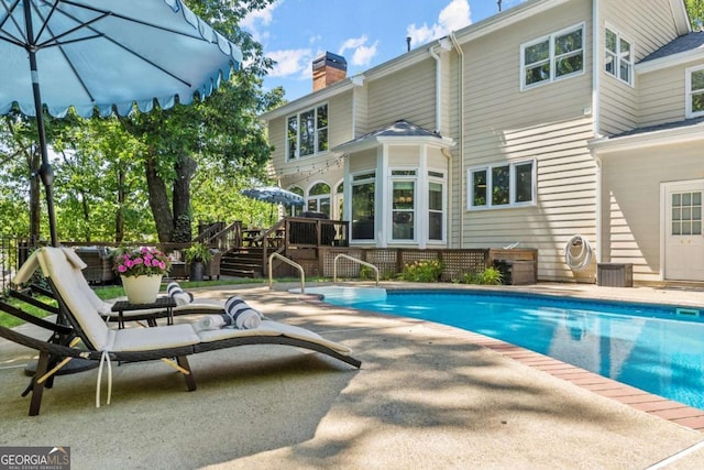 2936 Summitop Rd NE, Marietta, GA 30066 - swimming pool featuring a patio and a deck