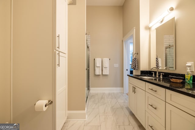 1 E 3rd Ave Unit 302, Rome, GA 30161 - bathroom with marble look tiles, vanity, baseboards, and an enclosed shower
