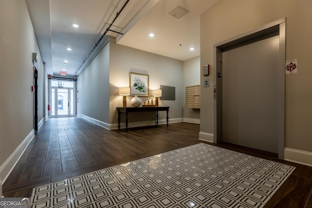1 E 3rd Ave Unit 302, Rome, GA 30161 - corridor featuring wood finished floors, elevator, baseboards, and recessed lighting