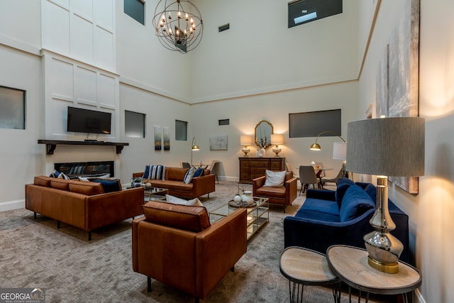 1 E 3rd Ave Unit 302, Rome, GA 30161 - carpeted living area with a towering ceiling, a glass covered fireplace, a chandelier, and baseboards