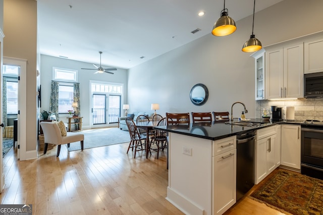 1 E 3rd Ave Unit 302, Rome, GA 30161 - kitchen with dishwasher, black range with electric cooktop, a sink, a peninsula, and open floor plan