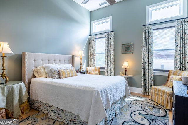 1 E 3rd Ave Unit 302, Rome, GA 30161 - bedroom featuring a high ceiling and wood finished floors