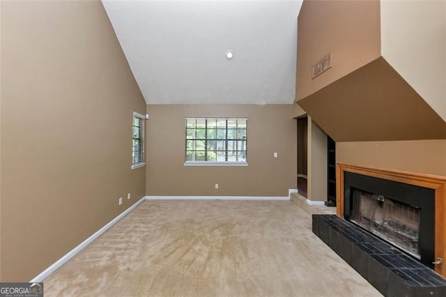 916 Forest Pointe Way, Jonesboro, GA 30238 - unfurnished living room with vaulted ceiling, carpet, baseboards, and a fireplace with raised hearth