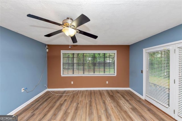 916 Forest Pointe Way, Jonesboro, GA 30238 - empty room with wood finished floors, baseboards, and a ceiling fan