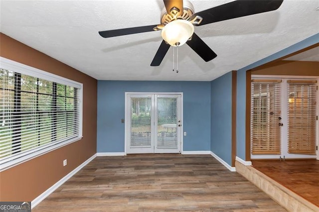 916 Forest Pointe Way, Jonesboro, GA 30238 - unfurnished room with baseboards, wood finished floors, and ceiling fan