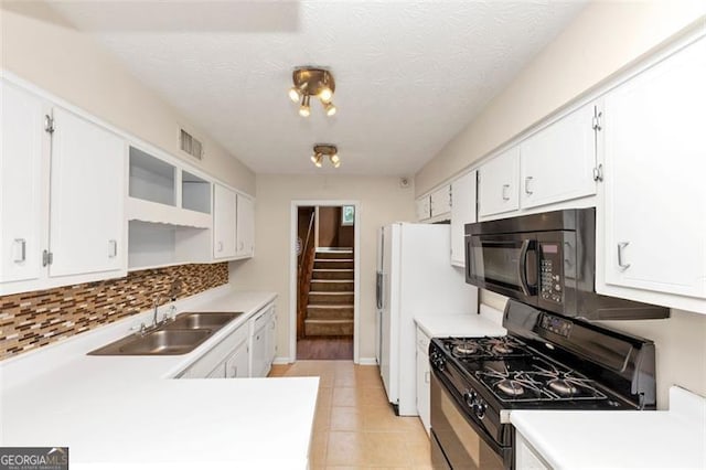 916 Forest Pointe Way, Jonesboro, GA 30238 - kitchen with black appliances, a sink, white cabinetry, light countertops, and a textured ceiling