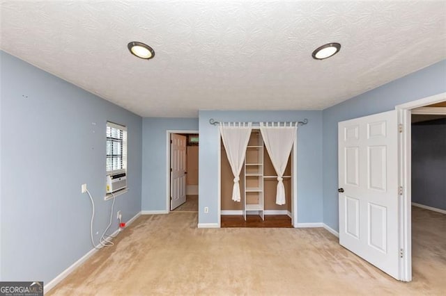916 Forest Pointe Way, Jonesboro, GA 30238 - unfurnished bedroom featuring light carpet, baseboards, a spacious closet, a textured ceiling, and a closet