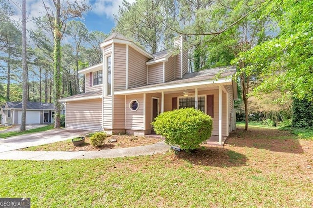 916 Forest Pointe Way, Jonesboro, GA 30238 - view of front facade featuring a chimney, covered porch, and a front lawn