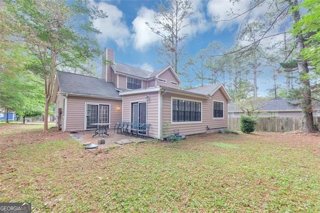 916 Forest Pointe Way, Jonesboro, GA 30238 - rear view of property with a chimney and a patio