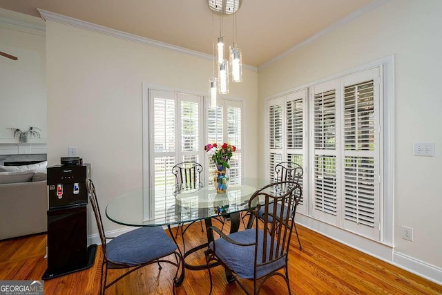 2484 Mossy Branch Dr, Snellville, GA 30078 - dining area featuring ornamental molding, wood finished floors, and baseboards