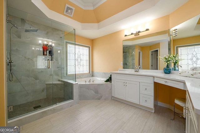 2484 Mossy Branch Dr, Snellville, GA 30078 - bathroom with a garden tub, plenty of natural light, vanity, a stall shower, and ornamental molding