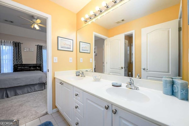 2484 Mossy Branch Dr, Snellville, GA 30078 - ensuite bathroom with double vanity, ceiling fan, and tile patterned flooring