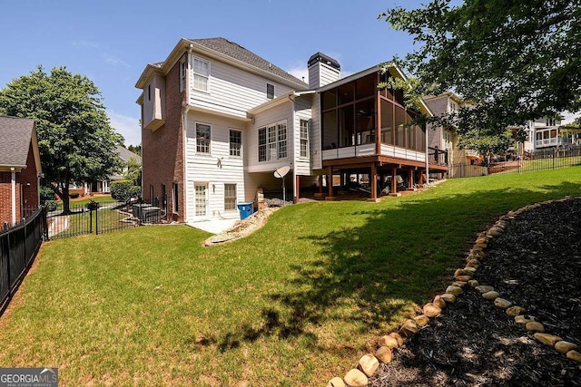 2484 Mossy Branch Dr, Snellville, GA 30078 - back of house featuring a sunroom and a chimney