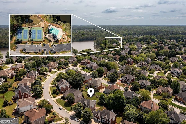 2484 Mossy Branch Dr, Snellville, GA 30078 - aerial view of residential area featuring property parcel outlined and a heavily wooded area