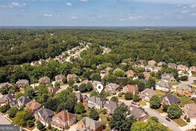 2484 Mossy Branch Dr, Snellville, GA 30078 - aerial perspective of suburban area with a heavily wooded area