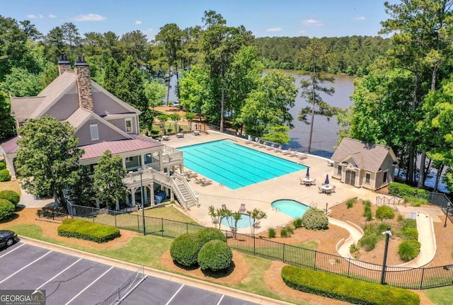 2484 Mossy Branch Dr, Snellville, GA 30078 - community pool featuring a patio area and a water view