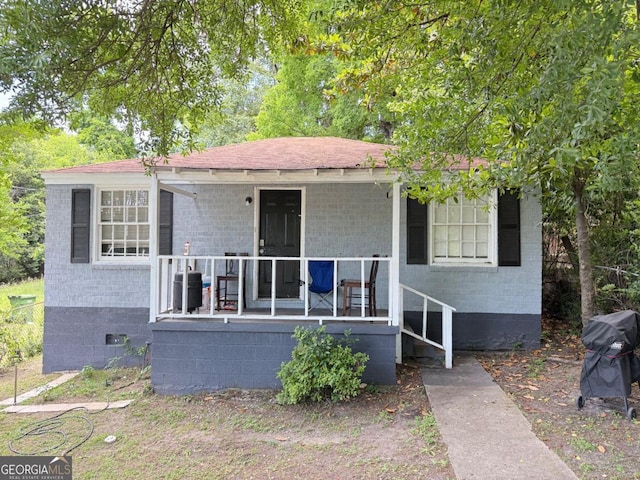 1237 9th St, Columbus, GA 31906 - view of front of home featuring a porch, crawl space, brick siding, and a shingled roof
