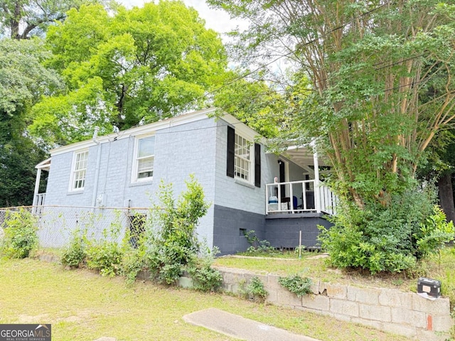 1237 9th St, Columbus, GA 31906 - view of side of home featuring a yard and concrete block siding
