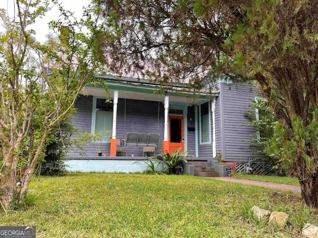 1432 Calhoun St, Macon, GA 31201 - view of front of property featuring a porch and a front lawn