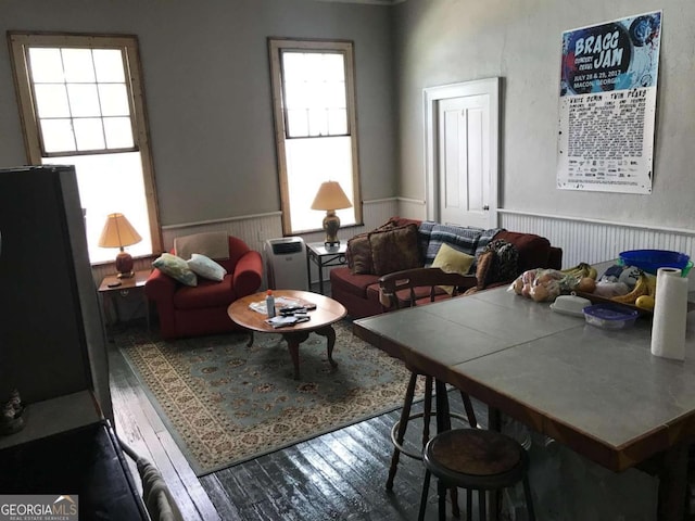1432 Calhoun St, Macon, GA 31201 - living area with wood finished floors and a wainscoted wall