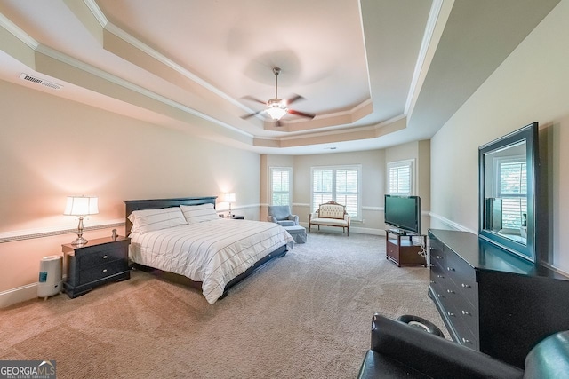 265 Enfield Ln, Mcdonough, GA 30252 - carpeted bedroom with a tray ceiling, ornamental molding, baseboards, and a ceiling fan