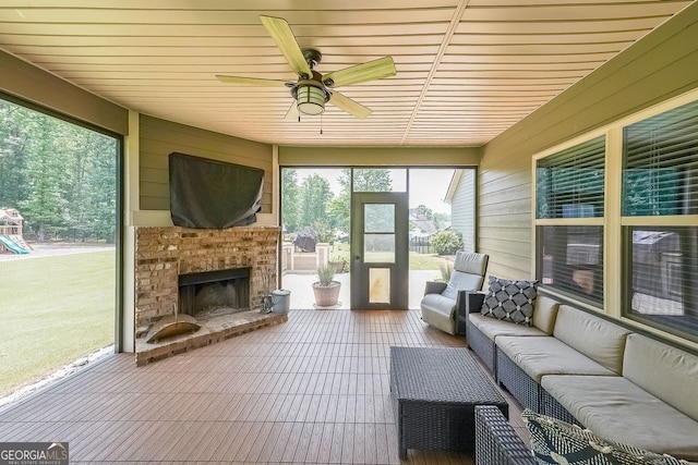 265 Enfield Ln, Mcdonough, GA 30252 - sunroom featuring an outdoor living space with a fireplace and ceiling fan