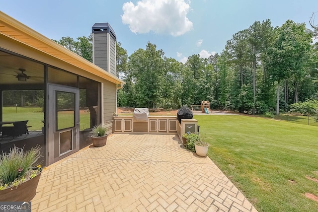 265 Enfield Ln, Mcdonough, GA 30252 - view of patio with an outdoor kitchen and a playground