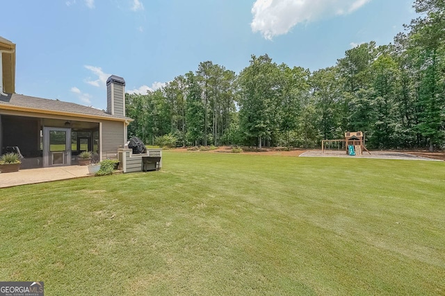 265 Enfield Ln, Mcdonough, GA 30252 - view of grassy yard featuring a playground