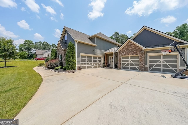 265 Enfield Ln, Mcdonough, GA 30252 - view of front of house with an attached garage, a front lawn, driveway, and stone siding