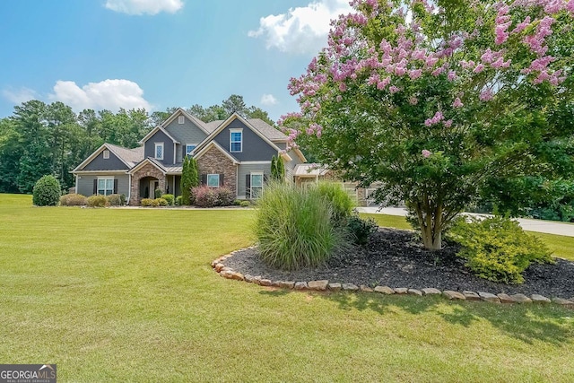 265 Enfield Ln, Mcdonough, GA 30252 - craftsman inspired home featuring a front lawn and stone siding