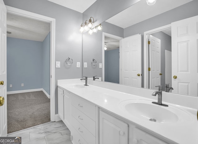4000 Mcpherson Dr, Acworth, GA 30101 - full bathroom featuring double vanity, a ceiling fan, and marble look tile flooring