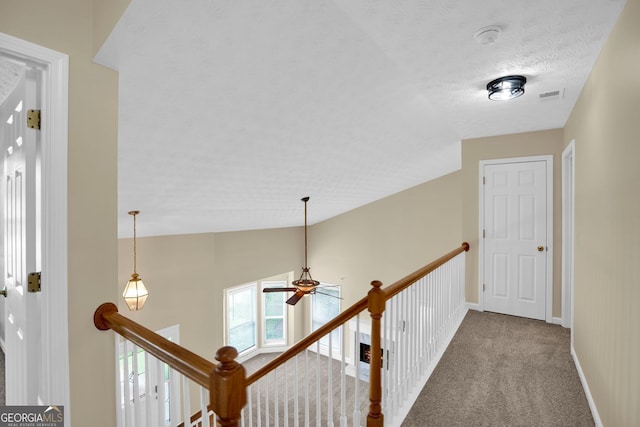 4000 Mcpherson Dr, Acworth, GA 30101 - hallway featuring an upstairs landing, carpet, lofted ceiling, and a textured ceiling