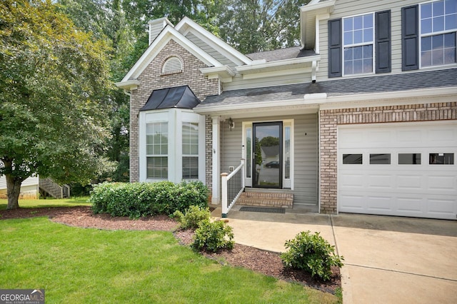 4000 Mcpherson Dr, Acworth, GA 30101 - entrance to property featuring a chimney, a lawn, a shingled roof, driveway, and brick siding