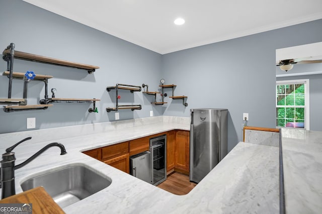 4000 Mcpherson Dr, Acworth, GA 30101 - kitchen with open shelves, freestanding refrigerator, brown cabinetry, wine cooler, and ornamental molding