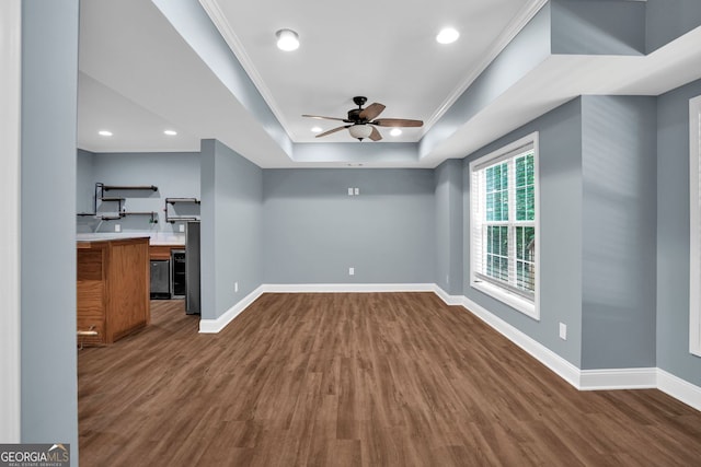 4000 Mcpherson Dr, Acworth, GA 30101 - unfurnished living room with a tray ceiling, dark wood-type flooring, a ceiling fan, recessed lighting, and crown molding