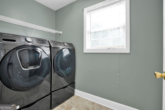 4000 Mcpherson Dr, Acworth, GA 30101 - laundry area featuring washer and clothes dryer and baseboards