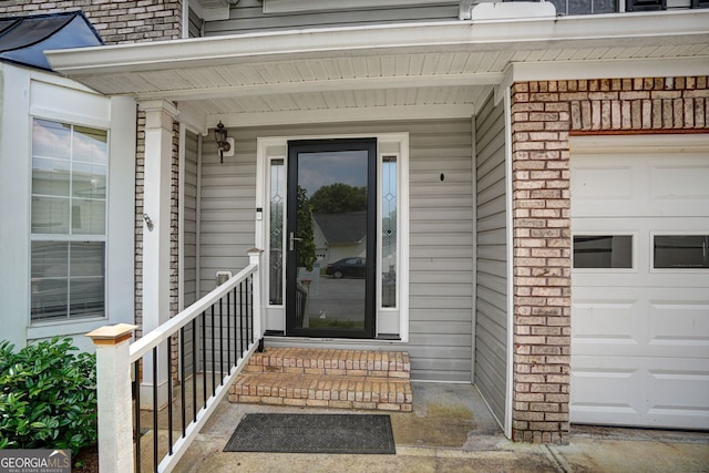 4000 Mcpherson Dr, Acworth, GA 30101 - doorway to property with brick siding, an attached garage, and a porch