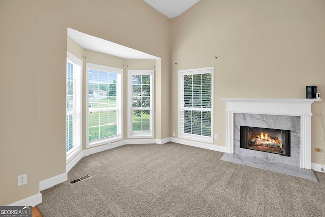 4000 Mcpherson Dr, Acworth, GA 30101 - unfurnished living room with a high end fireplace and carpet floors