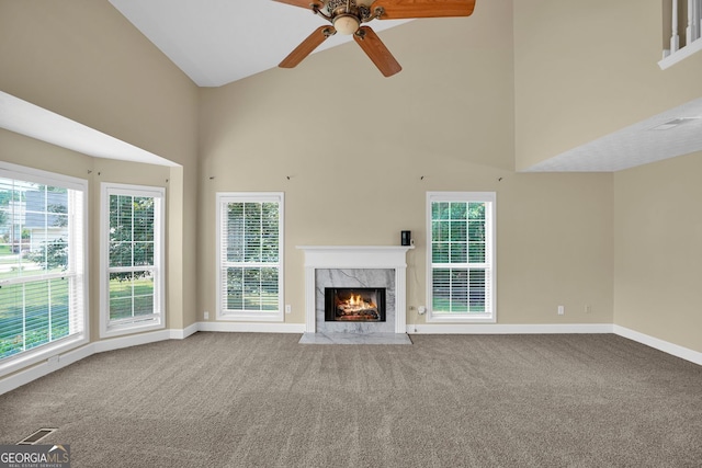 4000 Mcpherson Dr, Acworth, GA 30101 - unfurnished living room featuring high vaulted ceiling, carpet flooring, a premium fireplace, ceiling fan, and plenty of natural light