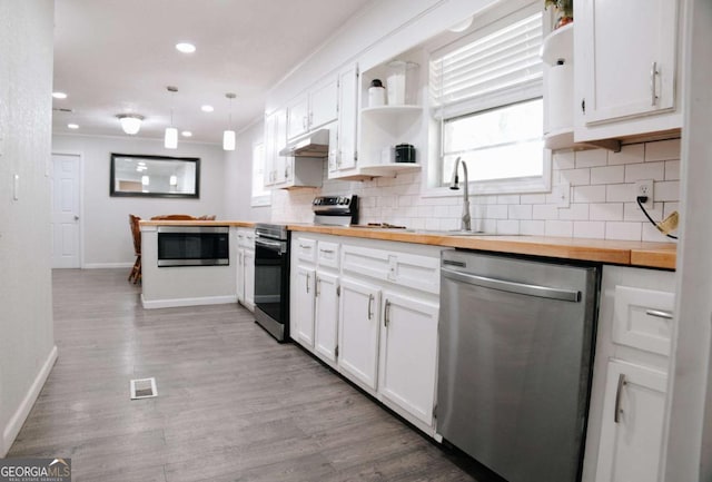 435 Goss Rd, Epworth, GA 30541 - kitchen with appliances with stainless steel finishes, open shelves, butcher block countertops, under cabinet range hood, and recessed lighting