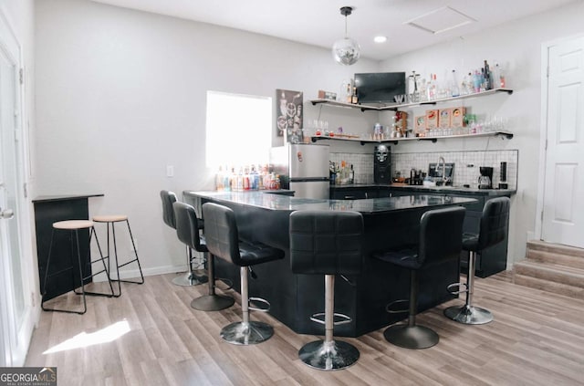 435 Goss Rd, Epworth, GA 30541 - indoor bar with freestanding refrigerator, backsplash, light wood-style floors, and recessed lighting